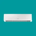 White wall mounted air conditioner unit against a teal background