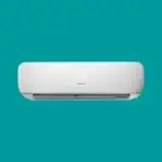 White wall mounted air conditioner indoor unit against teal background behind it