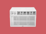 White window air conditioner with two control dials and front grille set against a red background