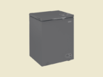 Gray compact chest freezer with a hinged lid front control dial on the lower right against a pale background