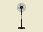 Black pedestal standing fan facing forward with visible blades and circular grill on a light beige background
