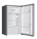 Open refrigerator with freezer on top displaying Fresh Zone panel and empty shelves inside