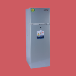 Tall silver refrigerator with a top freezer set against a red background Kenstar 168L double door refrigerator KSD 235S