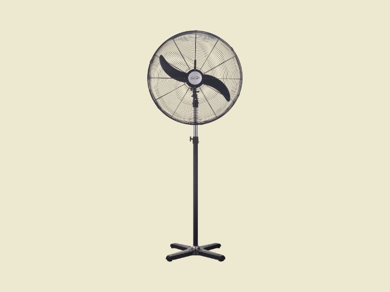 Kenstar Industrial Fans | Mitos Shoppers Black standing pedestal fan with a circular grille and four legged base on a pale yellow background