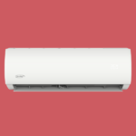 White wall mounted air conditioner unit with a digital display showing 26°C against a red background