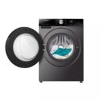 Front loading washing machine with its door open and clothes inside positioned beside a closed dryer door