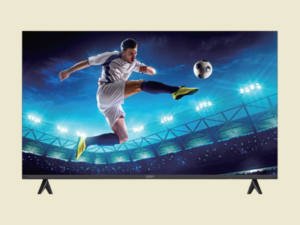 Television screen showing a soccer player mid air kicking a ball in a brightly lit stadium at night