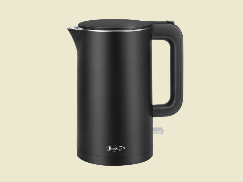 Black cordless electric kettle with a curved side handle and spout KenStar brand on the base set against a beige background