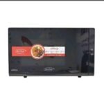 Black KenStar microwave oven with a red and white promotional label on the door
