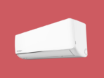 White wall mounted air conditioner unit against a red background visible brand area on the left side