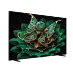 Flat screen TV displaying a green and gold decorative floral jewelry design on a black background