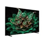 Flat screen TV displaying a green and gold decorative floral jewelry design on a black background