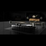 Luxurious black leather sectional in a glass walled lunar living room watching a Saturn image on a wall screen with surround speakers