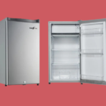 Stainless steel single door refrigerator with its door open showing shelves and a freezer at the top interior