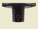 Black ceiling heater with a circular temperature dial and red indicator light