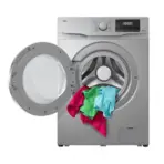 Front loading washing machine with colorful clothes tumbling out of the drum through an open door