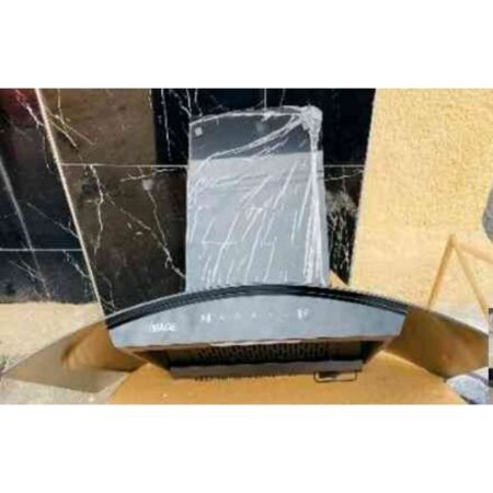 Curved car instrument cluster placed on a cardboard box with protective wrap and a cracked surface nearby.