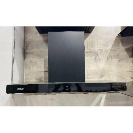 Top-down view of a black glossy soundbar on a glass table, with 'IMAGE' branding visible on the left.