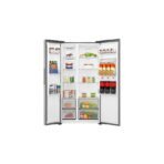 Open side by side refrigerator fully stocked with vegetables drinks and frozen goods visible in shelves and drawers