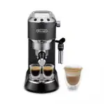DeLonghi espresso machine with two small glass cups of espresso and a latte glass beside it on a white background