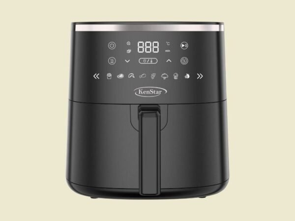 Black KenStar air fryer with digital control panel and vertical handle on a pale yellow background.