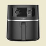 Black KenStar air fryer facing front with a large vertical handle and control panel on top set against a beige background ready to cook