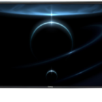 Flat screen TV showing a dark space wallpaper with glowing blue orbital rings and planetary silhouettes against a black background