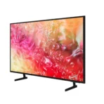 Slim flat screen TV on a stand displaying a vibrant abstract image in pink and orange hues
