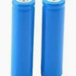 Two blue cylindrical batteries standing upright next to each other on a white background