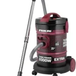 Nikai 2000W turbo canister vacuum with pink and black body and hose attachment