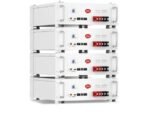 Four white ITel Energy battery modules stacked in a vertical rack showing red terminal bars and status indicators as part of an energy storage system